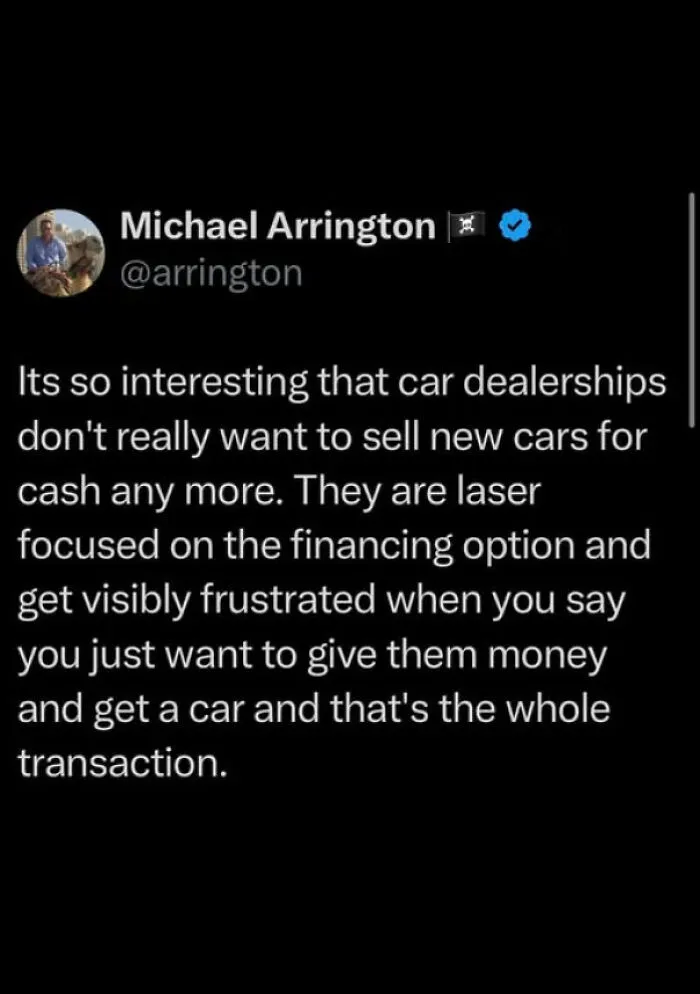 Tweet by Michael Arrington discussing frustration with car dealerships focusing on financing over straight cash sales in the world we're living in.