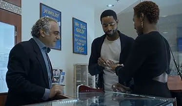 Scene from a drama series showing a social media con artist named Delvey interacting with a jewelry store clerk.