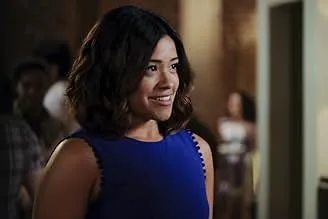 A young woman smiling indoors, representing a comedy-drama series about accidental artificial insemination.
