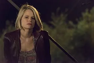 Young woman in a leather jacket looking thoughtful outdoors at night in a comedy-drama series about accidental insemination.