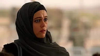 Young woman in a black hijab looking concerned, depicting a comedy-drama series about accidental artificial insemination.
