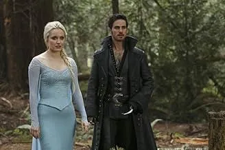Two characters in fantasy costumes standing in a forest, not related to prison drama or Litchfield Penitentiary TV show.