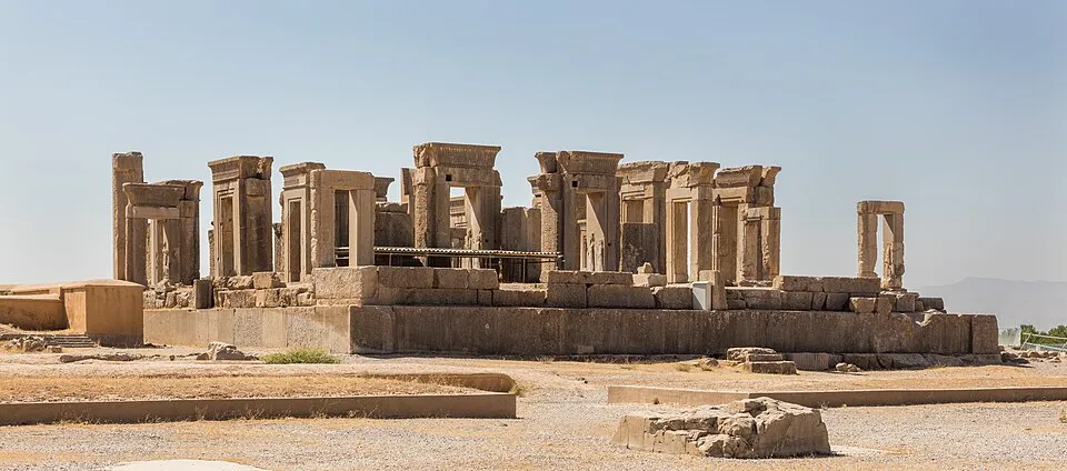 Ruins of ancient stone structures under clear sky representing a Middle Eastern country landmark.