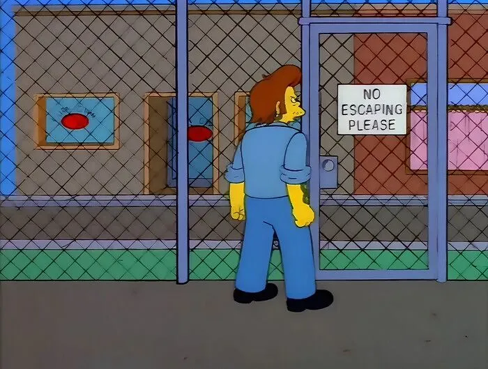 A Simpsons character standing by a fence gate with a sign that reads no escaping please in the show.