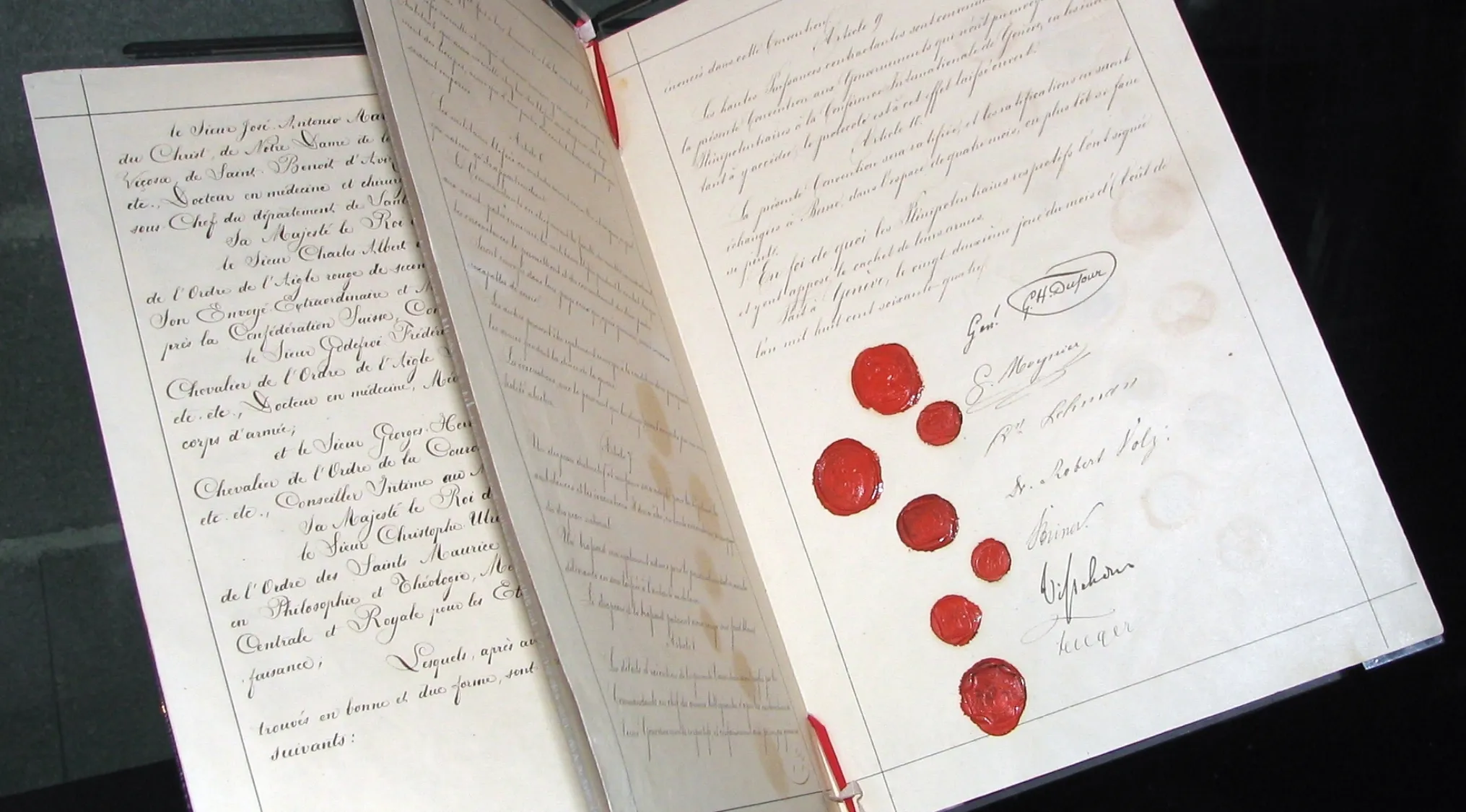 Historical document with red wax seals, illustrating the primary purpose of the League of Nations in history.