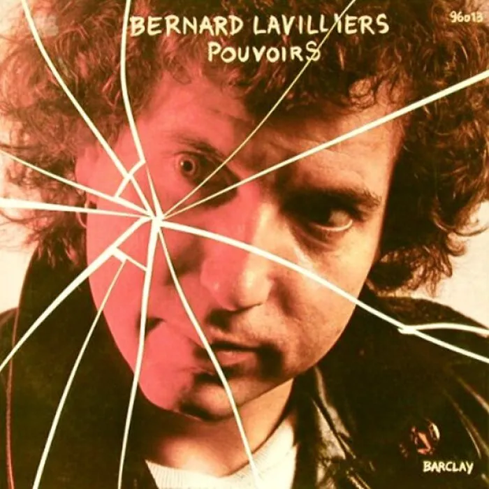 Close-up of a man's face with curly hair overlaid by a shattered glass effect on a bad album cover.