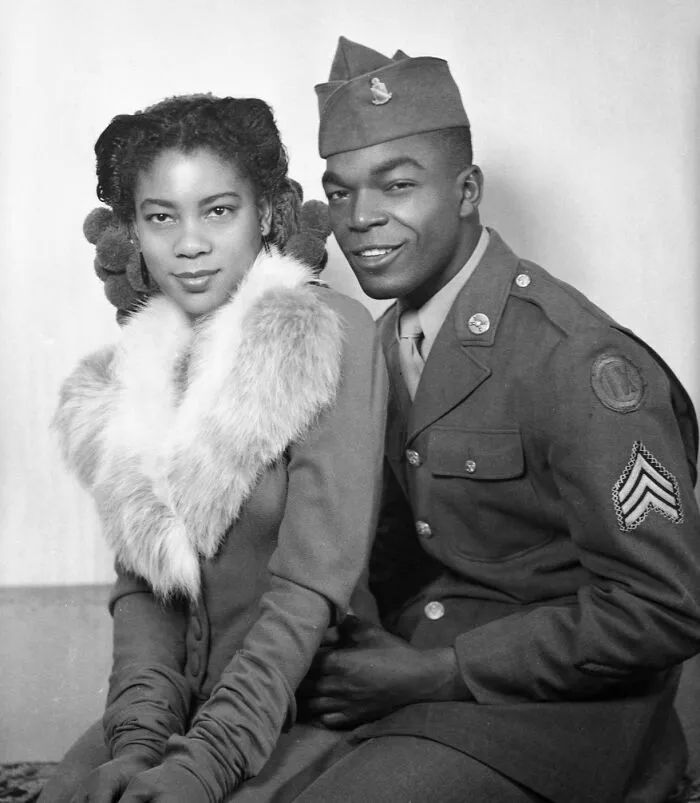 Couple During War Time Taking A Photo, Circa 1940s