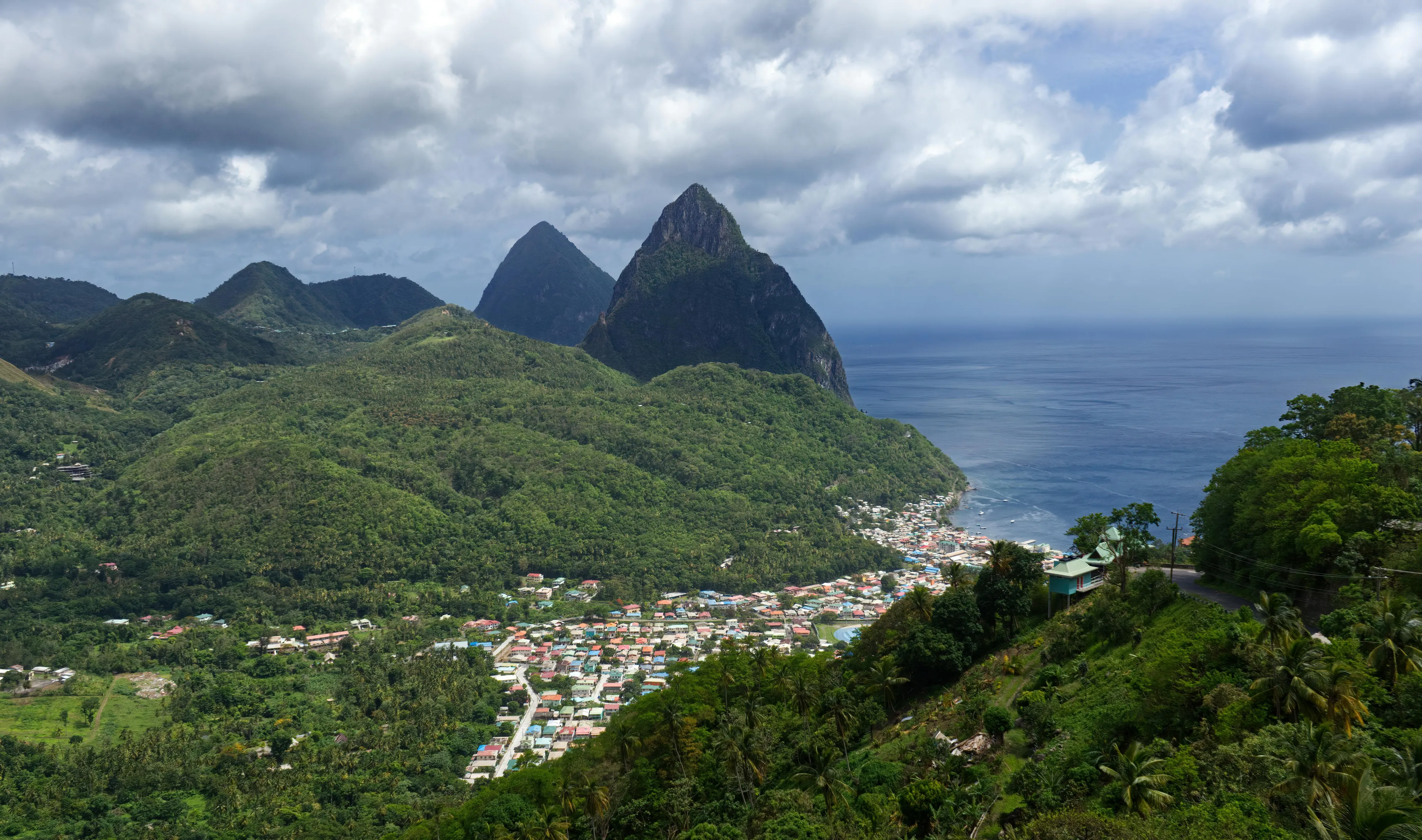 Lush green landscape with volcanic peaks in the background in the Caribbean nation of Saint Lucia.