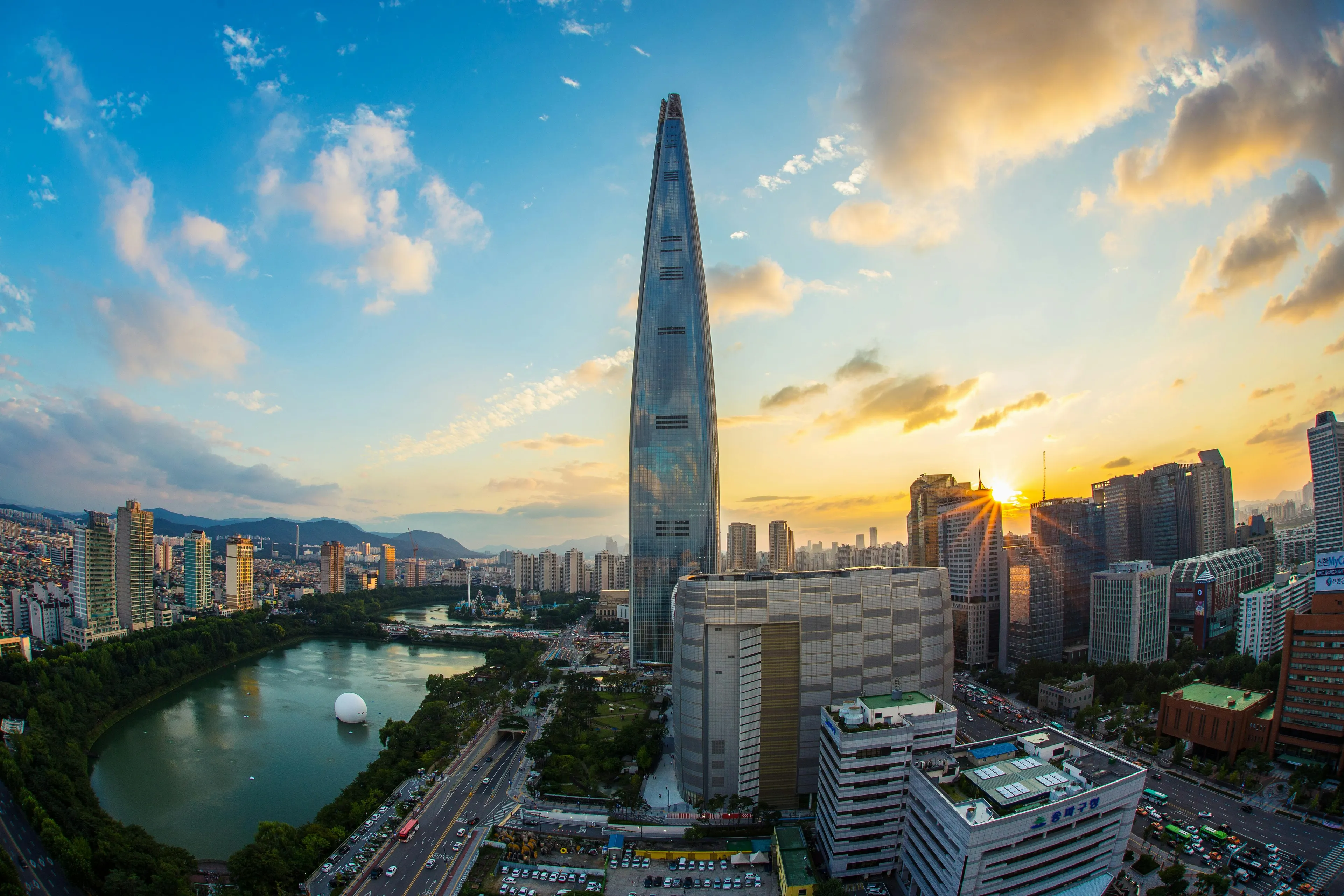 Seoul city skyline with Lotte Tower at sunset in South Korea, home to K-pop and vibrant urban life.