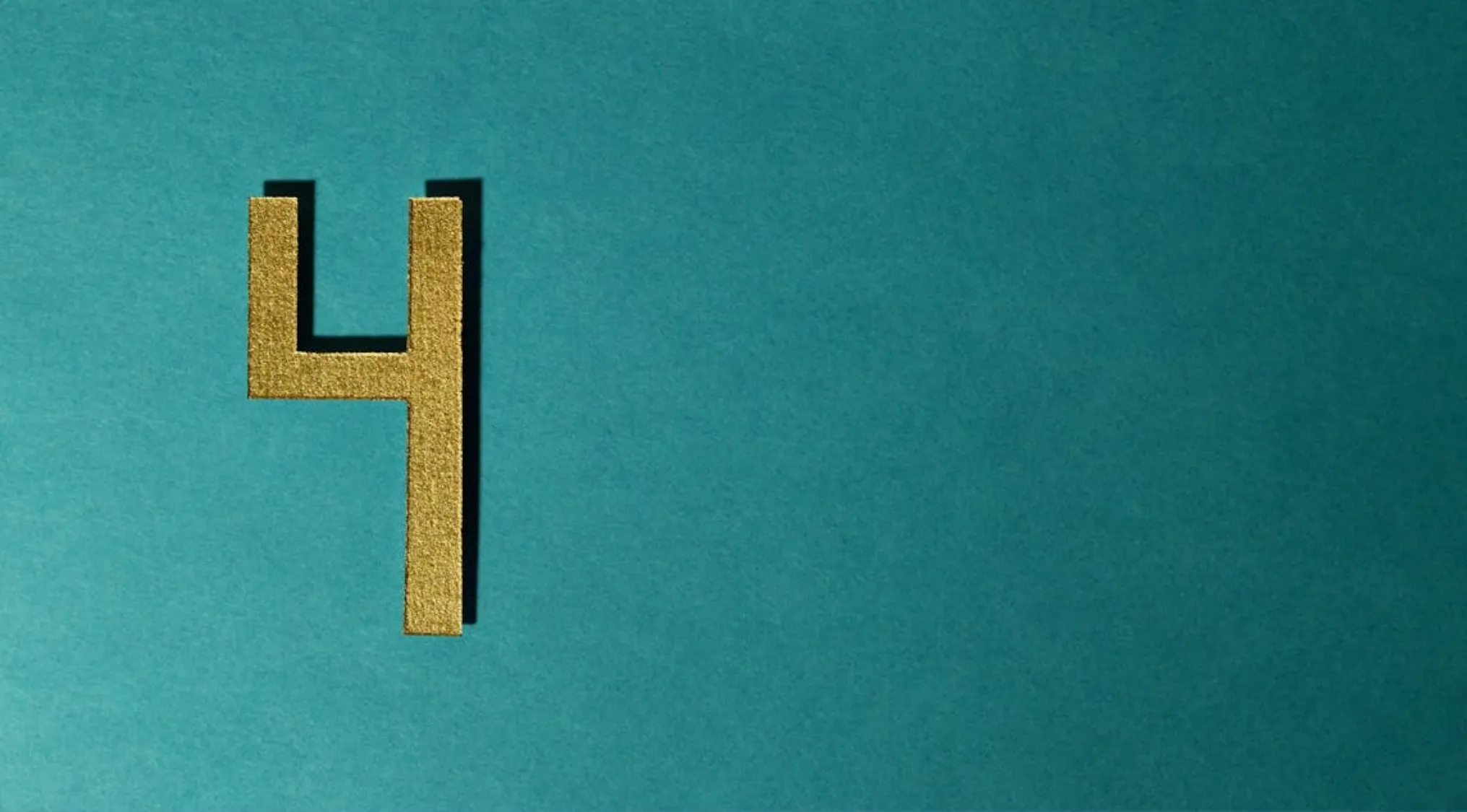 Gold number 4 on a teal textured background representing the 15 percent club question puzzle concept.