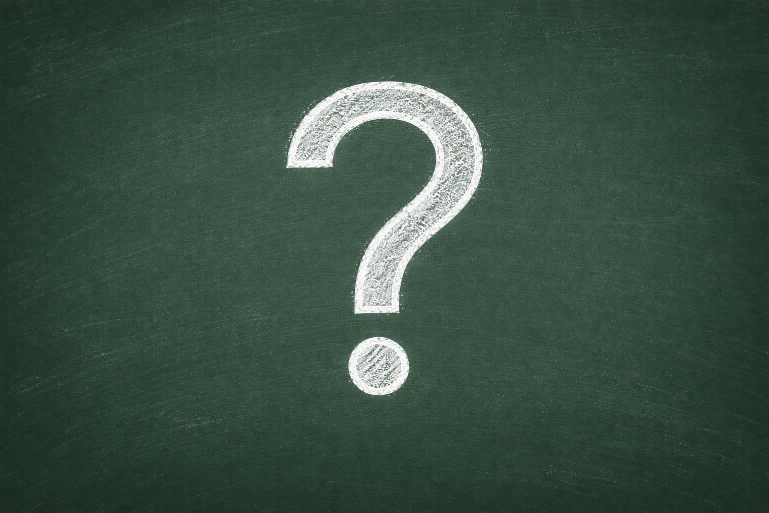 Large white chalk question mark drawn on a dark green chalkboard representing school math questions.