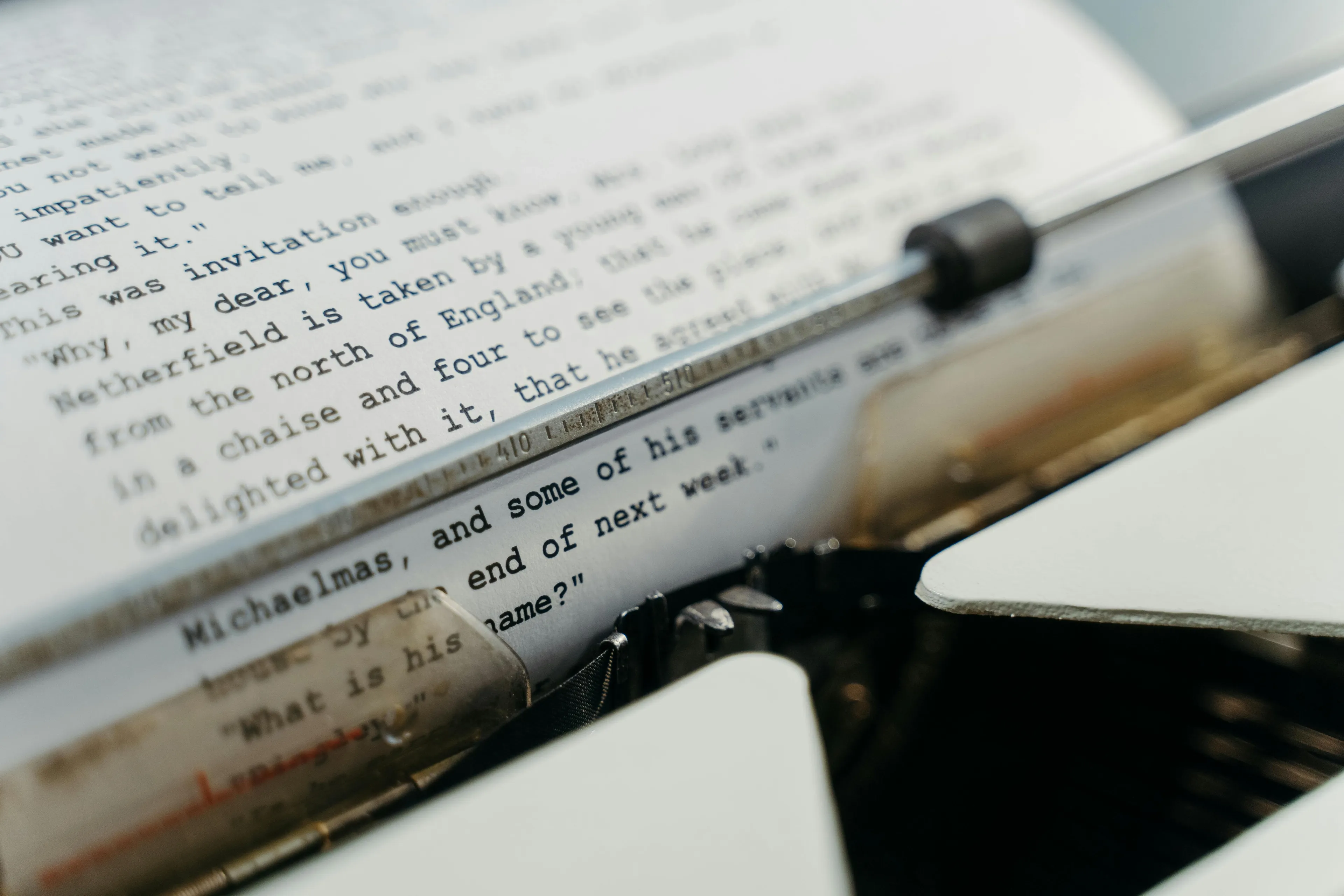 Close-up of typed text on paper in a typewriter focusing on active voice grammar in school questions.