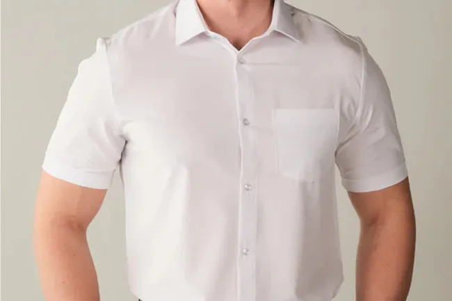 Man wearing a white short-sleeve dress shirt, showcasing a clean and classic fashion accessory for versatile style.