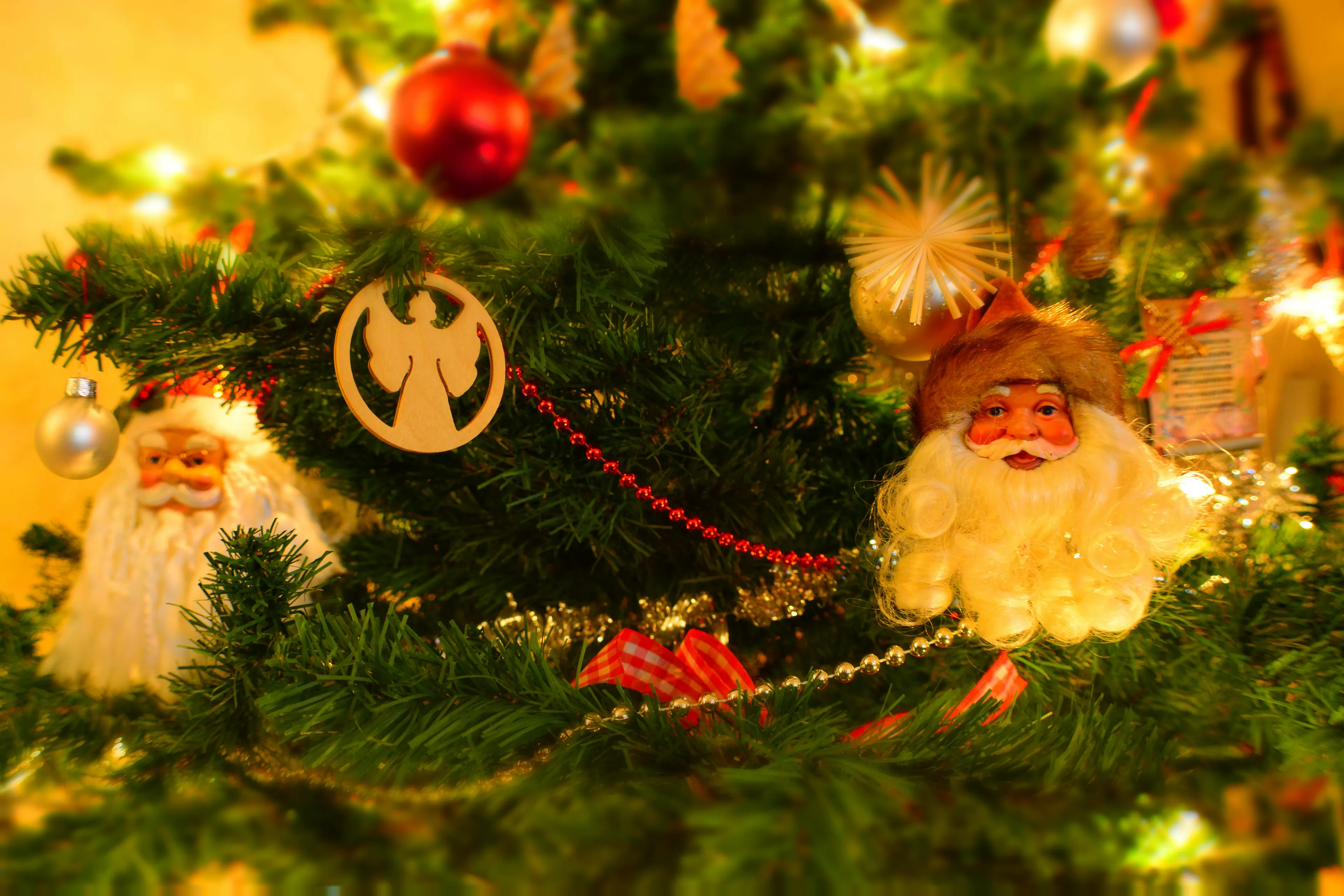 Christmas tree decorated with Santa and angel ornaments, highlighting seasonal activity for sitcom belonging quiz.