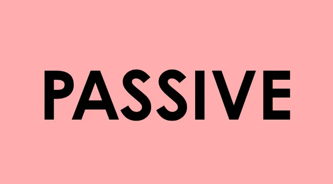 Text reading passive in bold black letters on a light pink background for UK school grammar test.