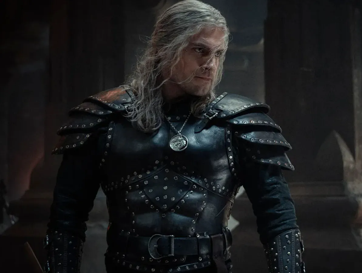 Character in dark studded armor with long silver hair, mentor of main cast character Geralt in The Witcher series.