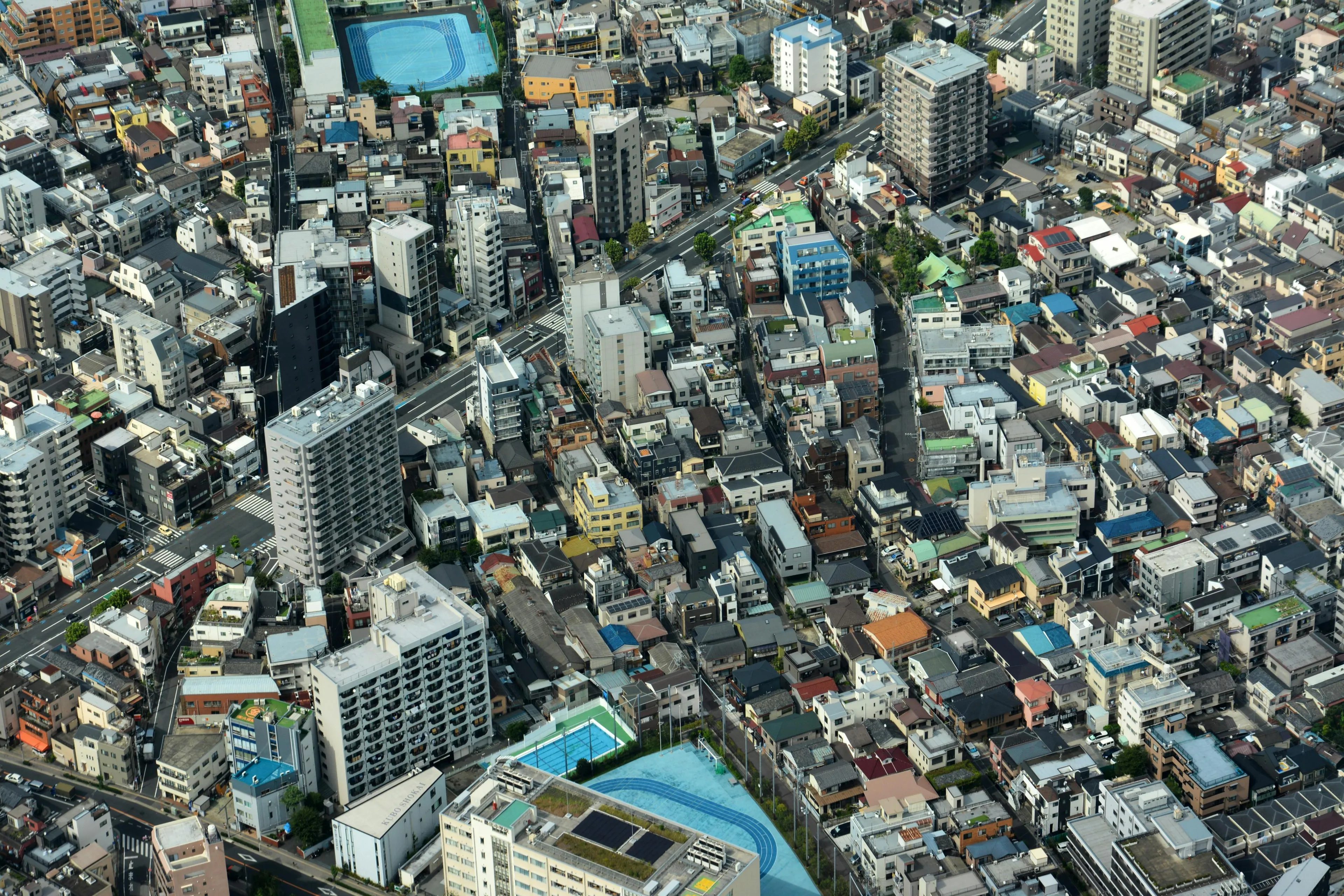 Aerial view of dense residential and urban buildings in the Greater Tokyo Area showcasing geography true-or-false concept.