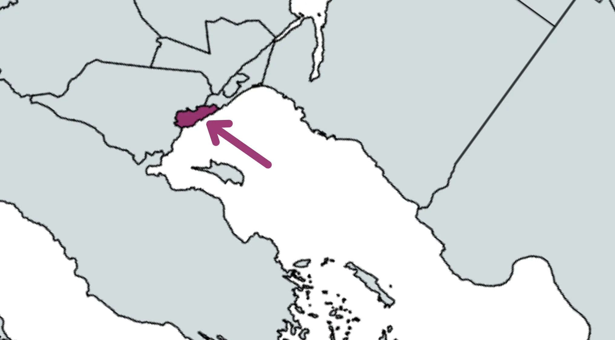Rotated world map geography challenge highlighting a country in Central America with a purple arrow pointing to it.