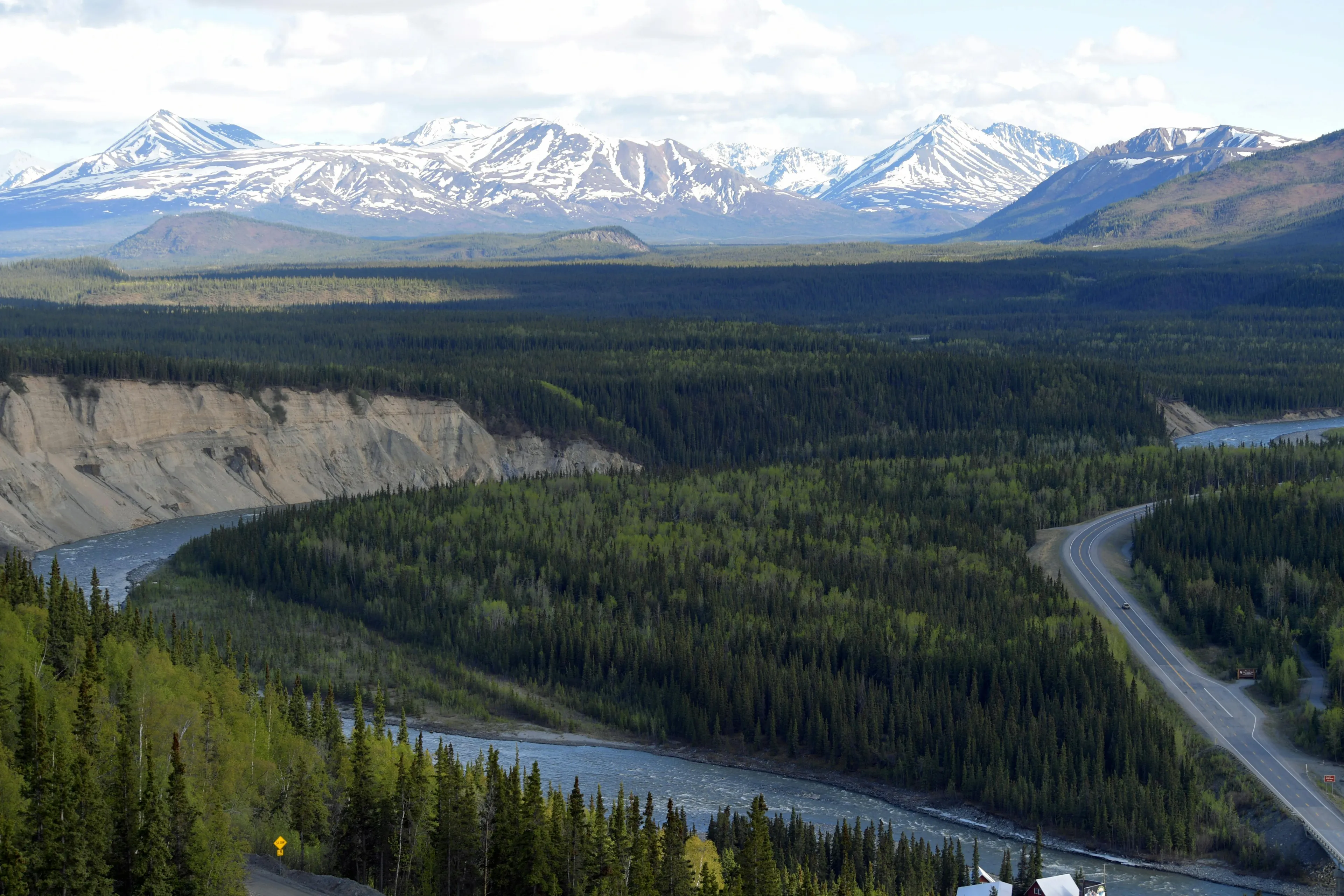 Alaska landscape with river, forest, and snow-capped mountains illustrating geography true-or-false questions theme.