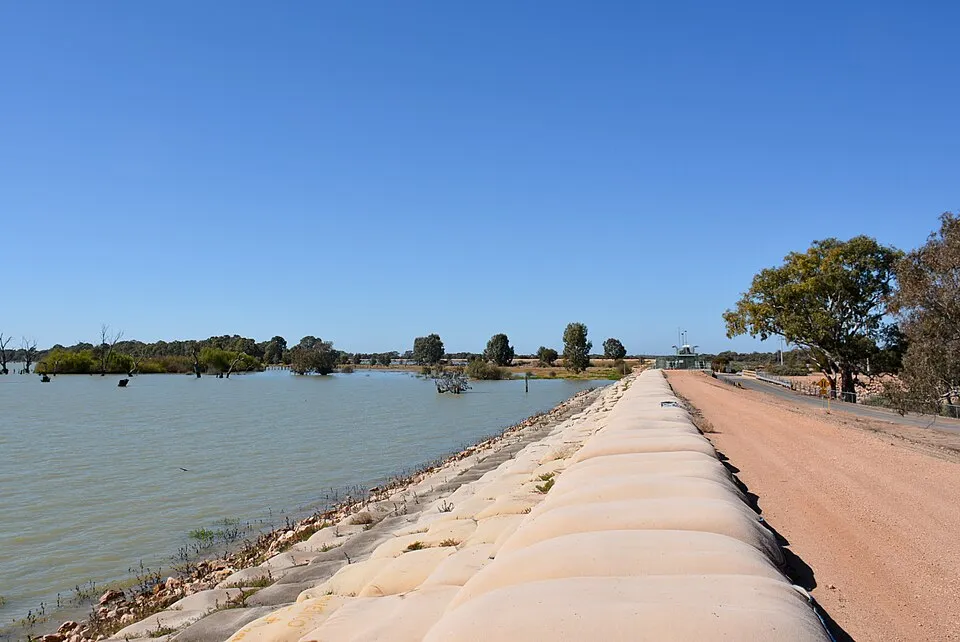 Dam and water body under a clear blue sky, representing Lake Victoria in East Africa geography questions.