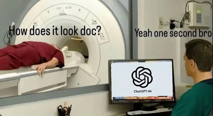 Patient lying inside an MRI machine asking the doctor while the doctor checks results on a computer healthcare meme.