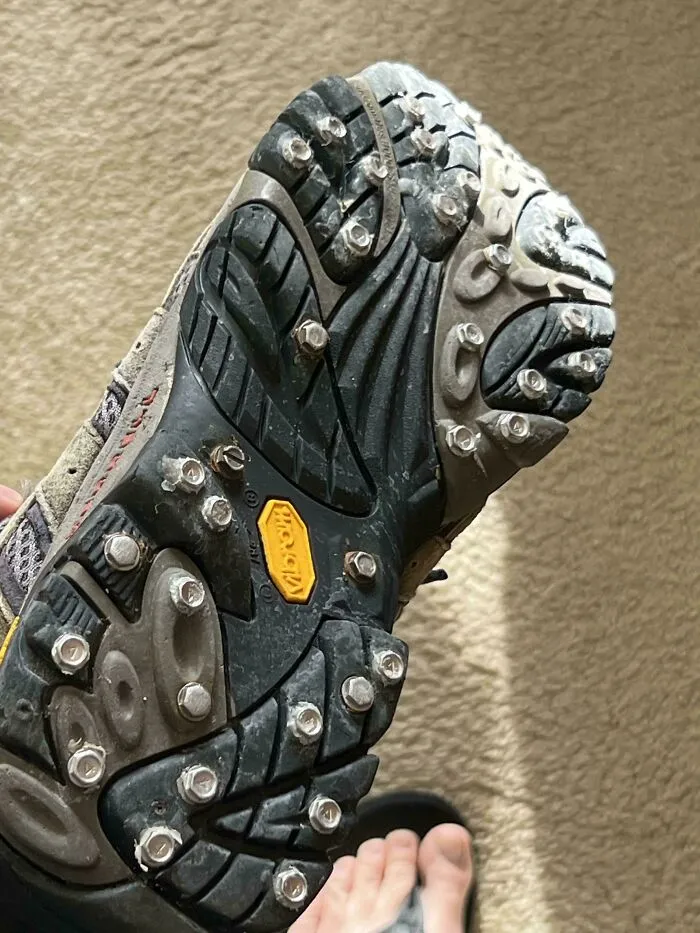 Shoe sole modified with bolts for extra grip, an example of redneck engineering that might worry actual engineers.