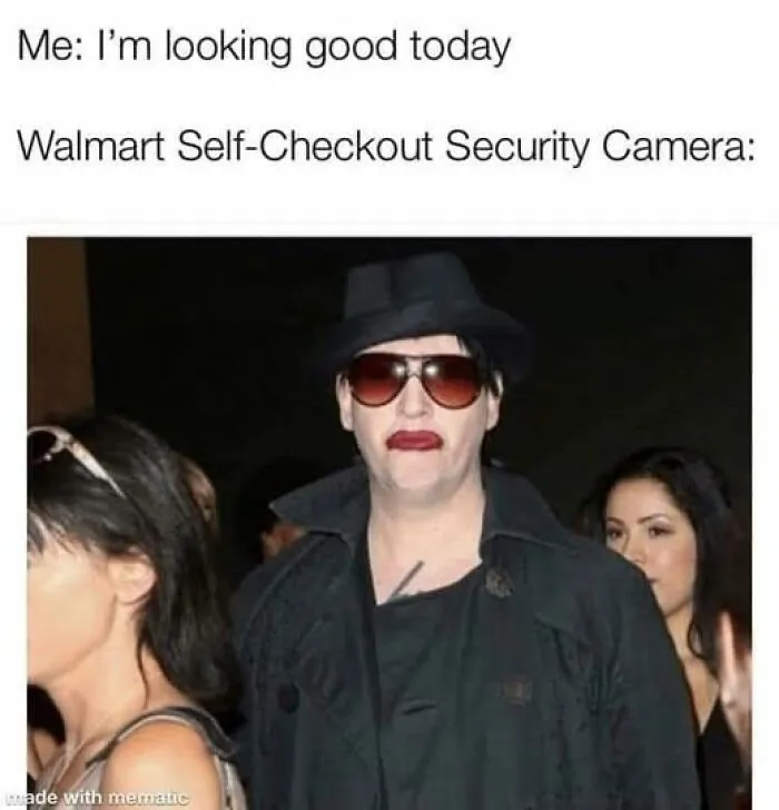 Person wearing dark coat, hat, and sunglasses with red lipstick, relating to relatable memes that hit way too close to home.
