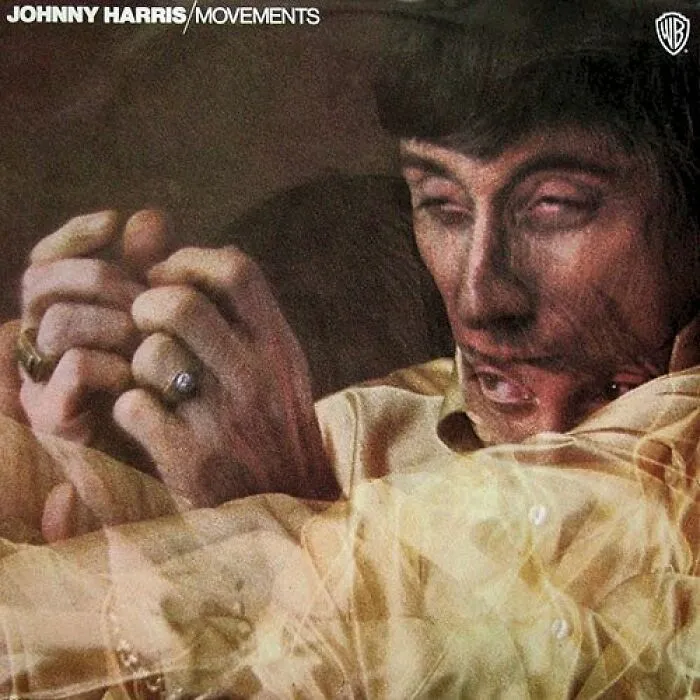 Blurred double exposure of a man with rings on his fingers on a hilariously bad album cover from actual sold records.