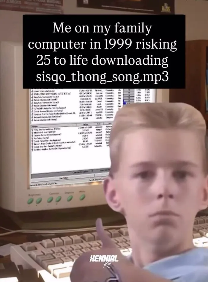 Boy giving thumbs up in front of old computer, funny meme about downloading song, fitting energy memes with humor.