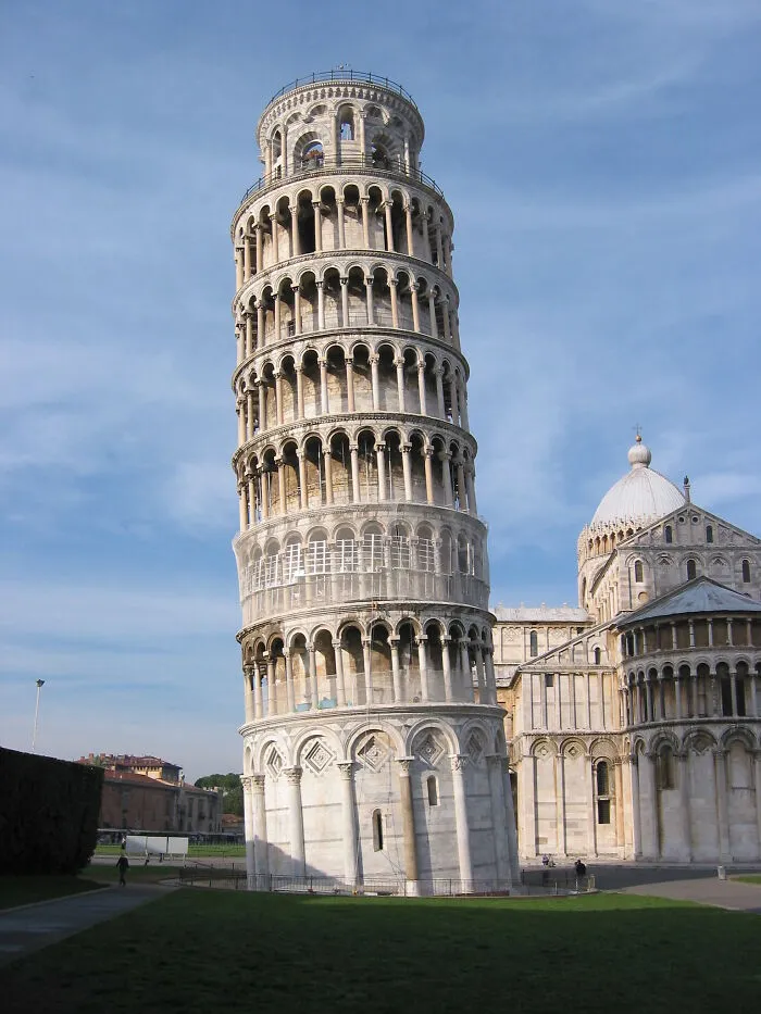 Leaning Tower of Pisa, a disappointing tourist attraction that locals still don’t get, under clear blue sky.