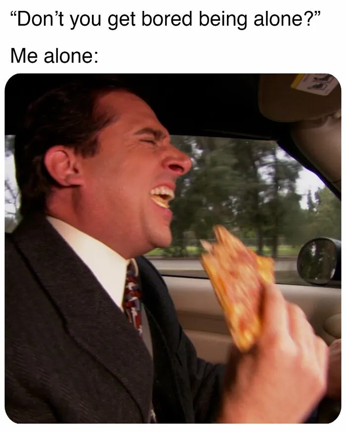Man from The Office laughing loudly while eating pizza in a car, a popular meme inspired by the TV series.