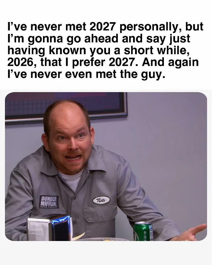 Man wearing a Dunder Mifflin shirt making a funny face in a meme inspired by the TV series The Office.
