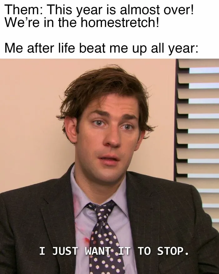 Man in suit with messy hair and tired expression in an Office-inspired meme about life struggles and the year ending.