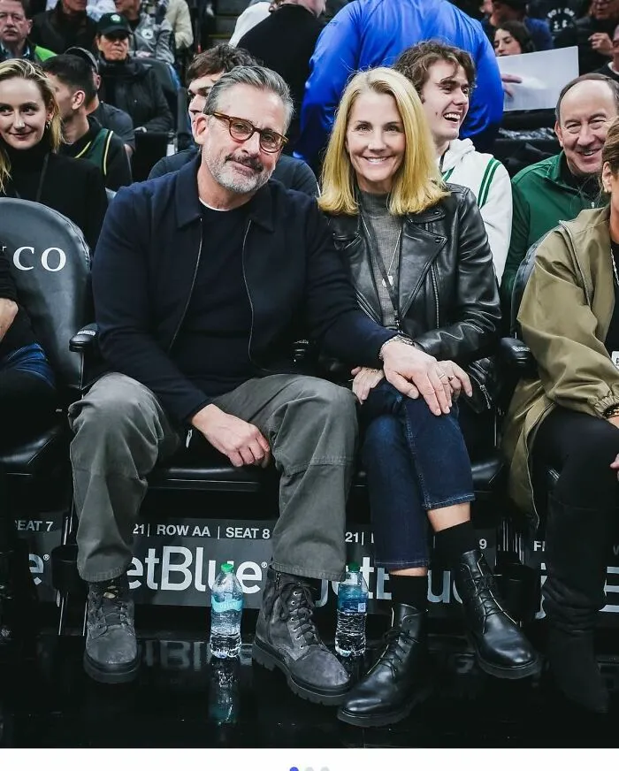 Man and woman smiling and sitting close together at an event, capturing a moment related to memes inspired by the TV series The Office.
