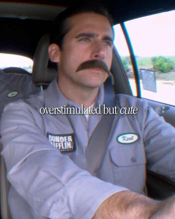 Man in Dunder Mifflin uniform driving car with mustache, meme inspired by TV series The Office and people cracking up