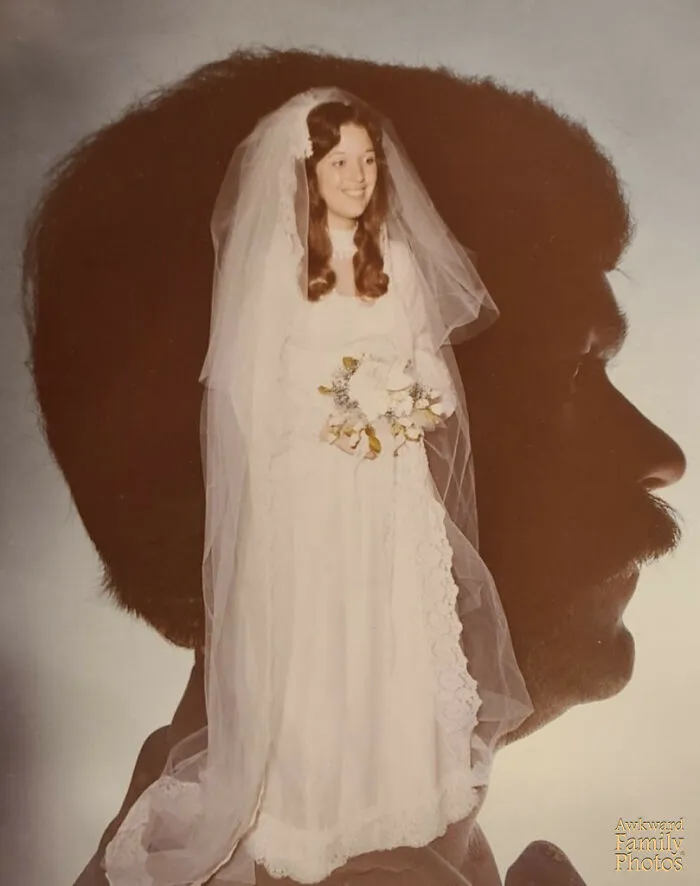 Bride in vintage dress with veil inside silhouette of groom's profile in awkward wedding photo creative double exposure.