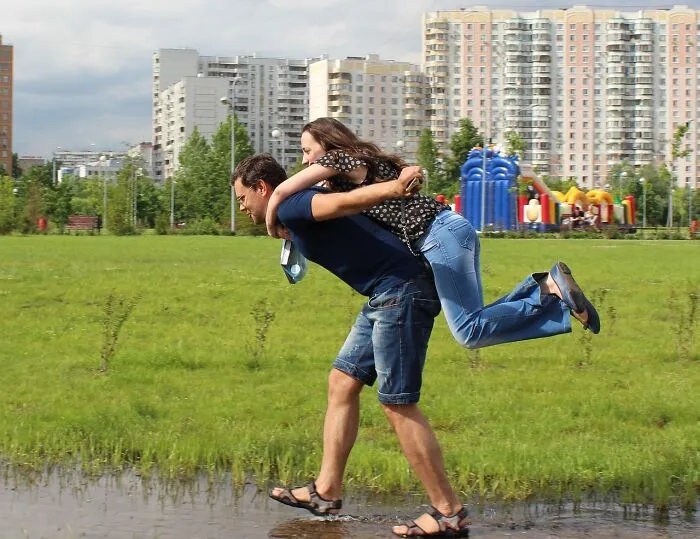 Carrying Her Over Puddles/Mud