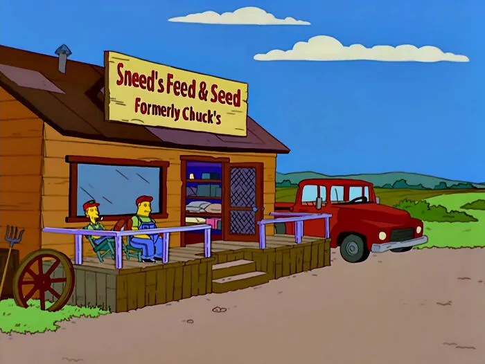 The Simpsons scene showing Sneed's Feed & Seed sign, one of the best signs featured in the series.