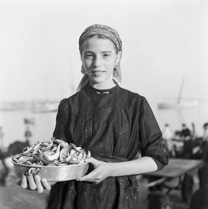 A Market Girl Shows Off Her Wares, By The Sea, Netherlands, 1940s
