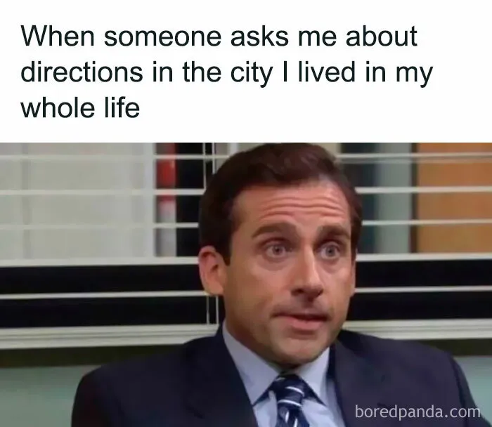Man in suit looking awkward and unsure when asked for directions, relatable meme about life as an introvert.