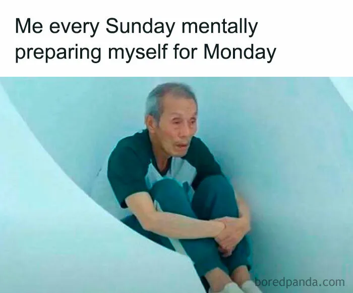 Man sitting curled up inside a circular space, representing relatable memes about life as an introvert preparing for Monday.