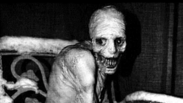 Black and white eerie photo of a distorted figure, illustrating internet photos that are not what they seem.