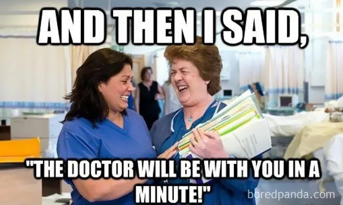 Two healthcare workers laughing together, sharing a humorous meme about doctors and medical waiting times.