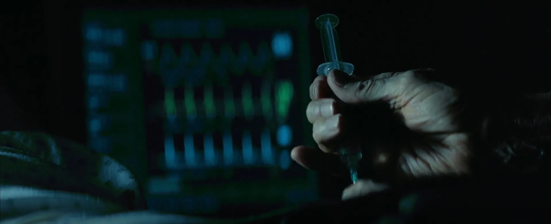 Close-up of a hand holding a syringe during a dark final scene from a movie final scenes part 3.