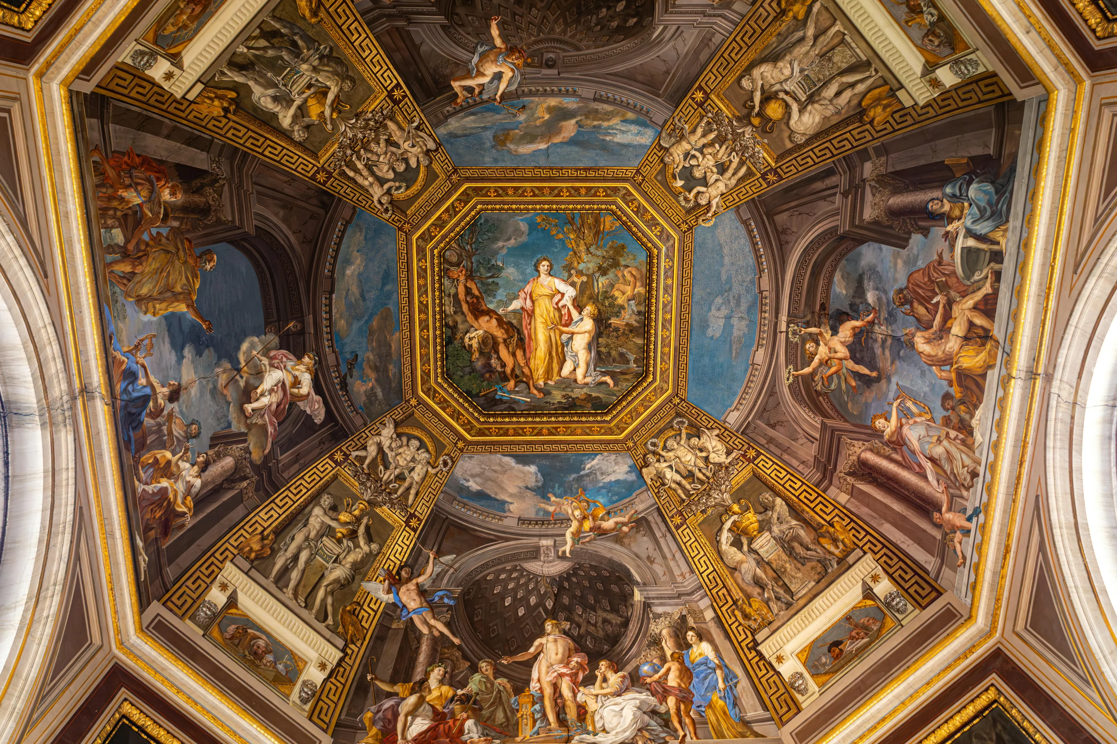 Ceiling painting inside old church uses artistic technique creating illusion of three-dimensional space opening into the sky.