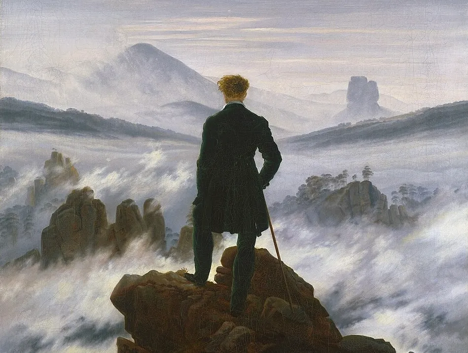 The Wanderer above the Sea of Fog painting by German artist showing a man overlooking misty mountains.