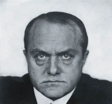 Portrait of German artist Max Beckmann with an intense expression, known for emotionally powerful paintings.