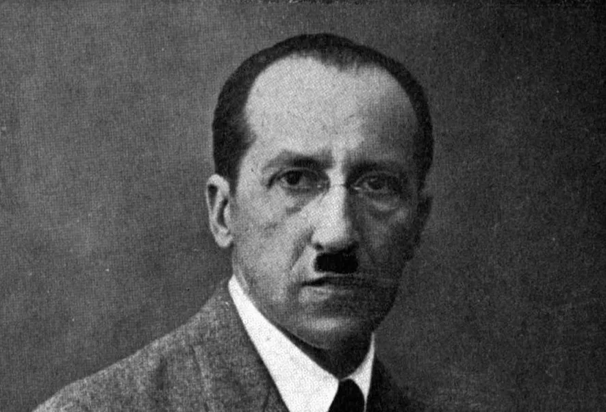 Portrait of Piet Mondrian, the artist associated with the geometric art movement De Stijl, wearing a suit and tie.