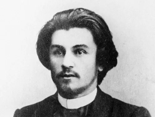 Black and white portrait of Kazimir Malevich, an artist associated with the geometric movement De Stijl.