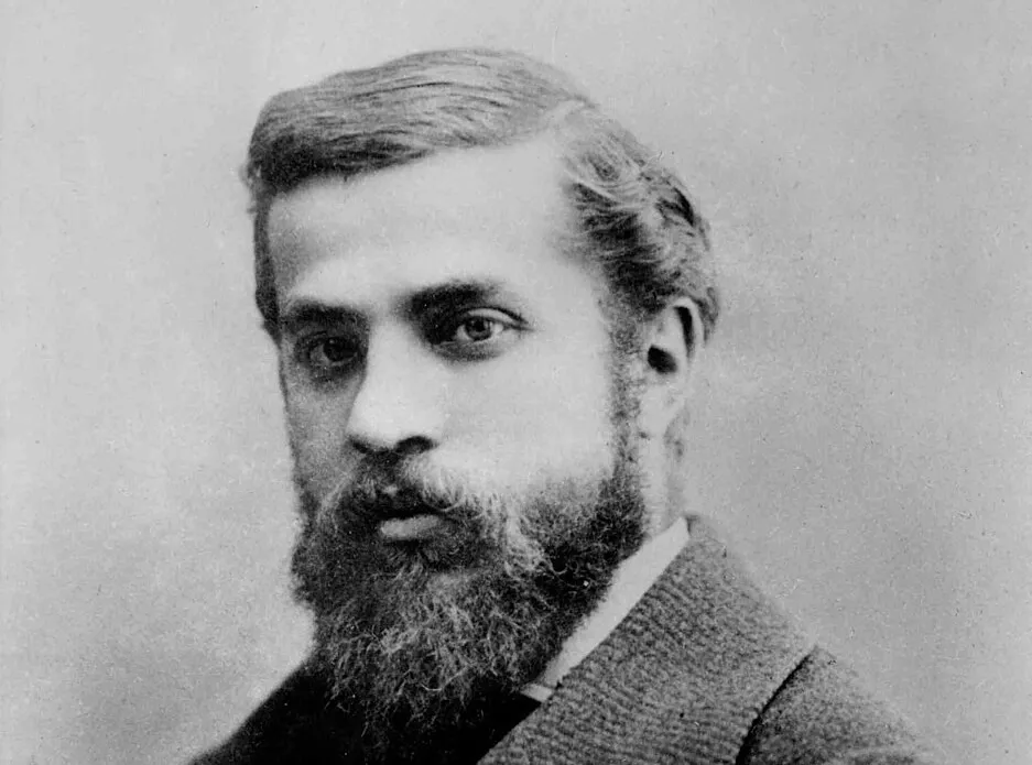 Antoni Gaudí in a black and white portrait photograph, showcasing the architect behind Sagrada Família Barcelona.